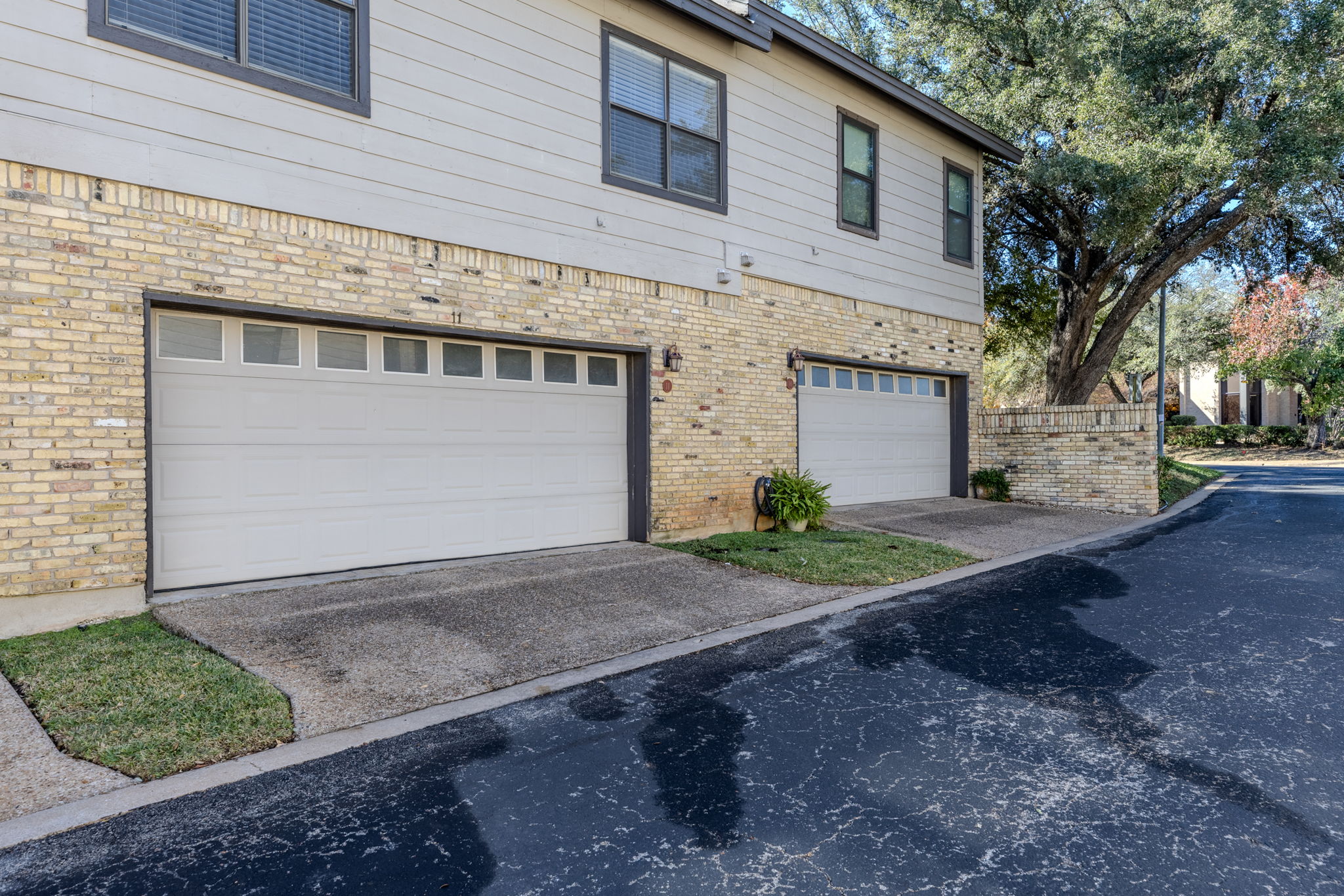 10819 Crown Colony Drive, Unit 11 Austin, TX 78747 - Photo 8 of 40 Pulling in feels easy and practical, with direct access that makes daily routines seamless.
