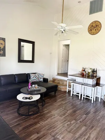 a living room with furniture and a table