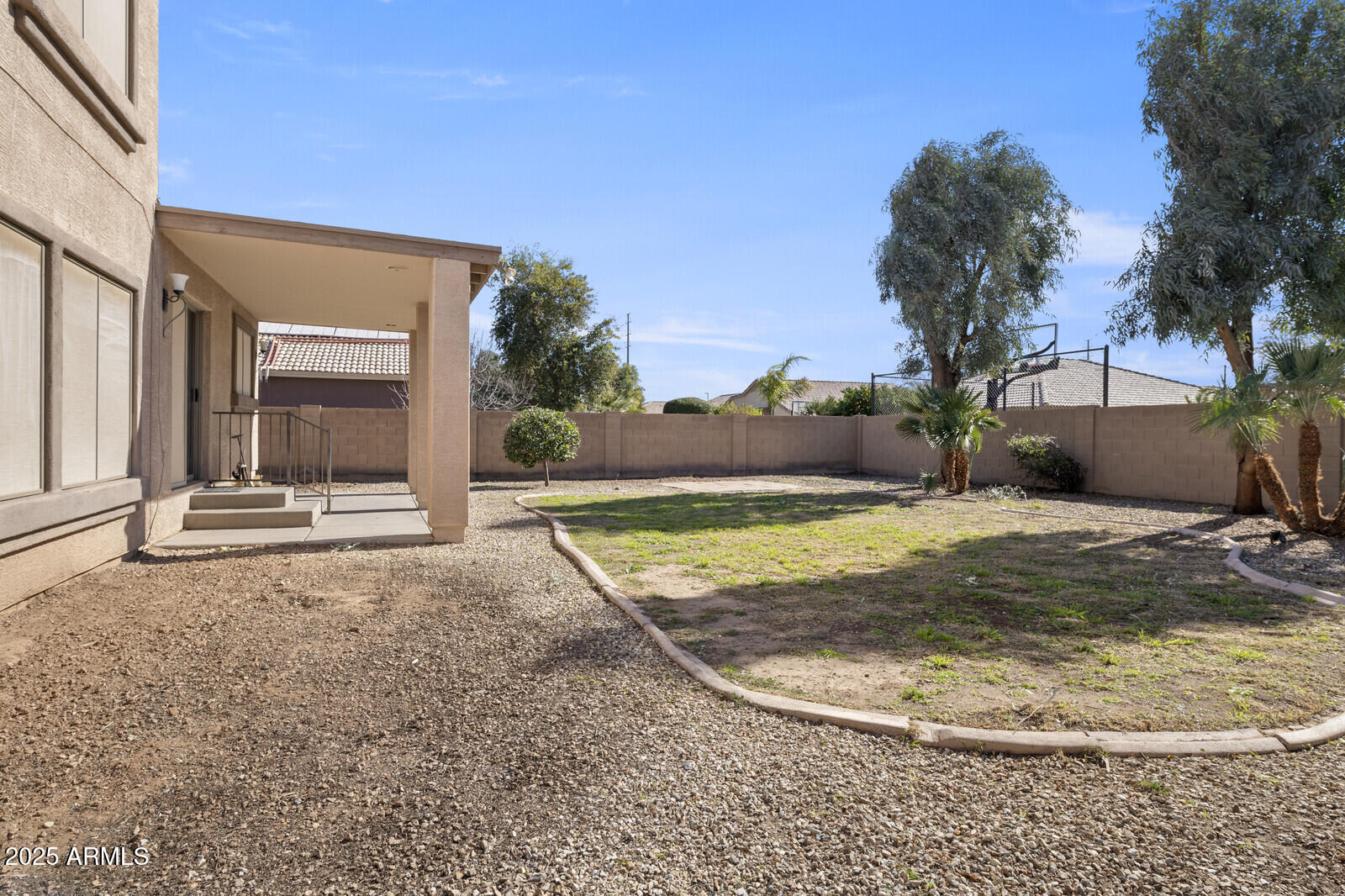 3297 East Warbler Road Gilbert, AZ 85297 - Photo 30 of 32 a view of a house with a yard