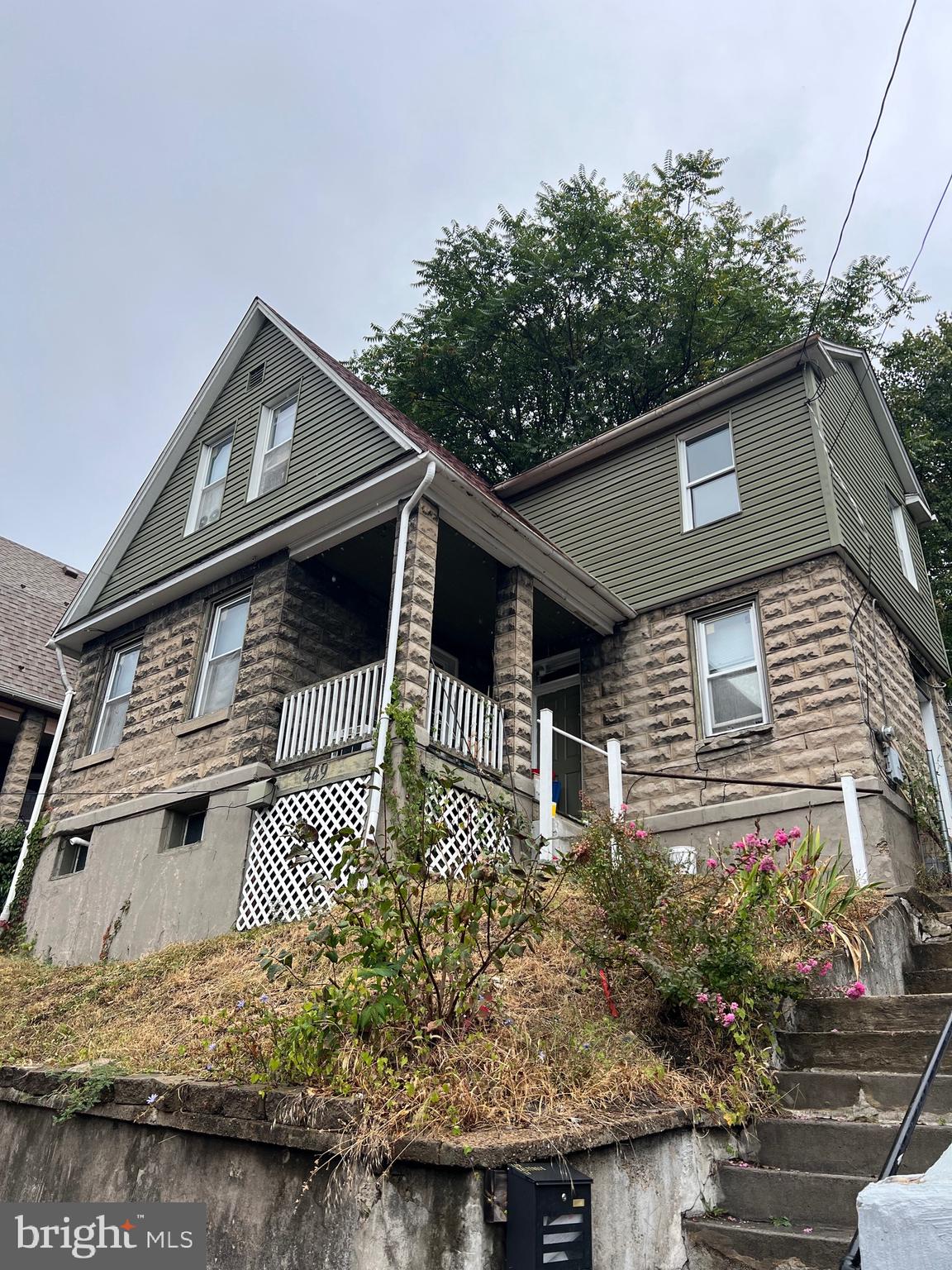 449 Baltimore Avenue Cumberland, MD 21502 - Photo 1 of 22 a front view of a house with a yard
