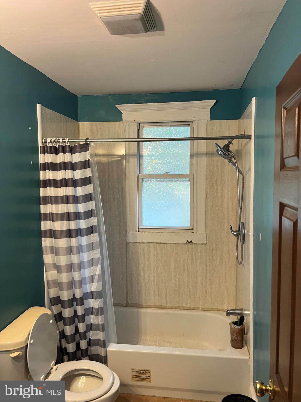 449 Baltimore Avenue Cumberland, MD 21502 - Photo 12 of 22 a bathroom with a sink toilet and shower