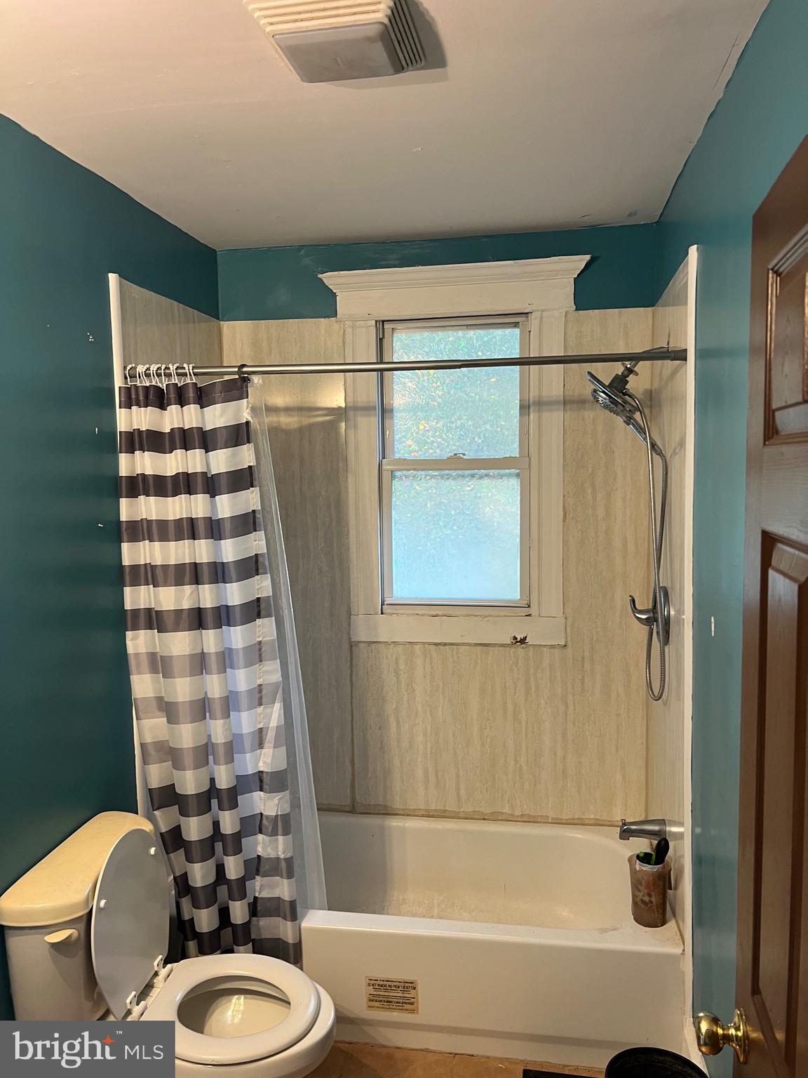 449 Baltimore Avenue Cumberland, MD 21502 - Photo 13 of 22 a bathroom with a sink toilet and shower