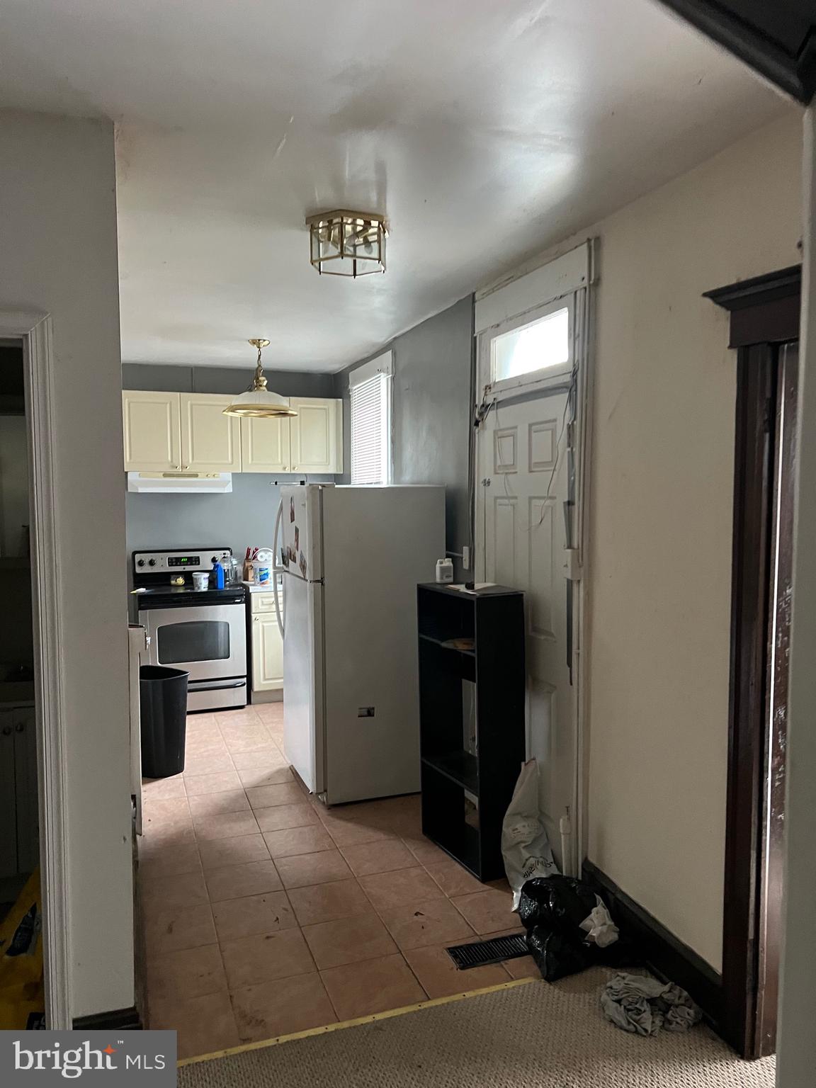 449 Baltimore Avenue Cumberland, MD 21502 - Photo 15 of 22 a kitchen with refrigerator and window