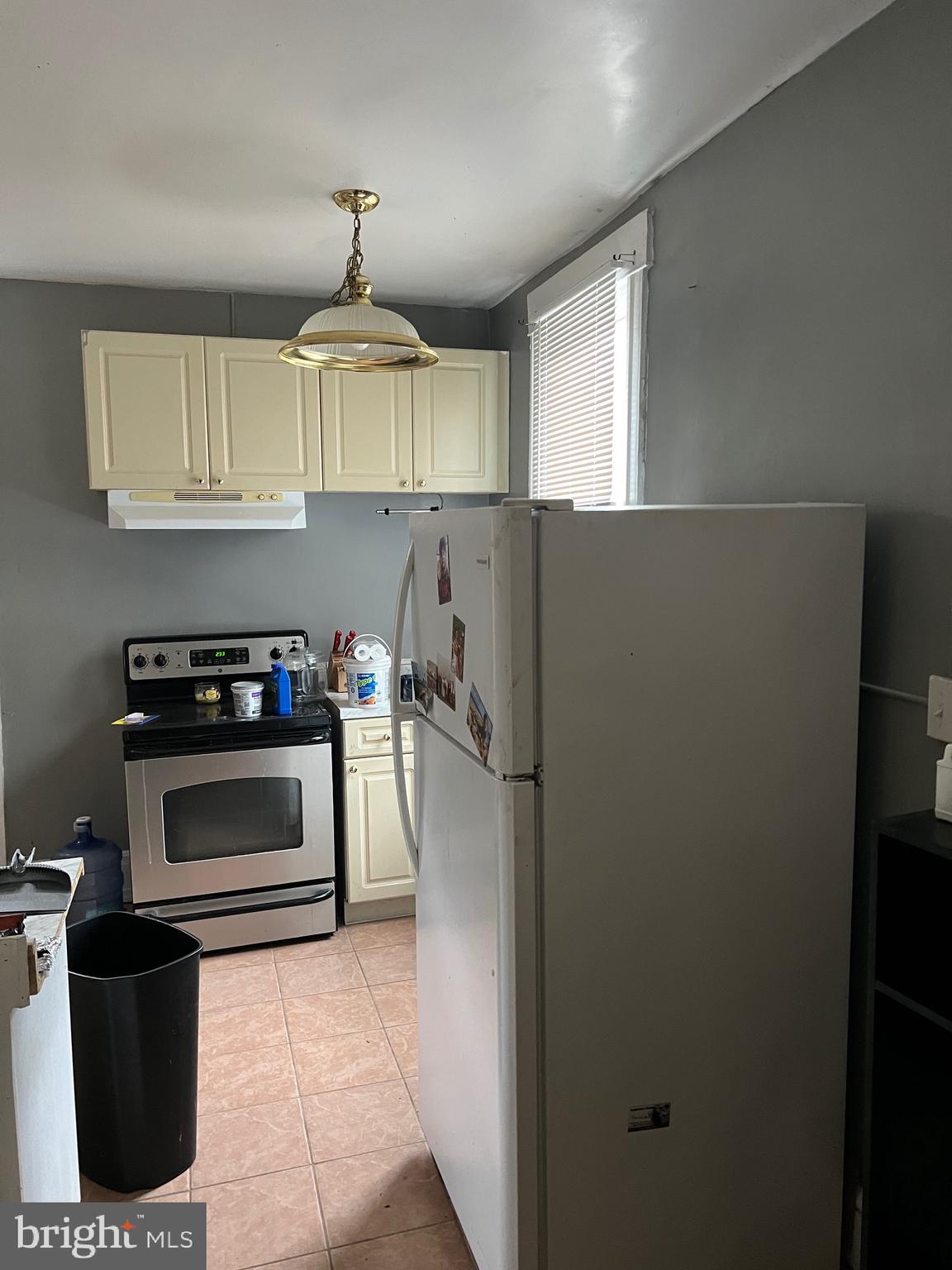 449 Baltimore Avenue Cumberland, MD 21502 - Photo 17 of 22 a kitchen with a stove and a refrigerator
