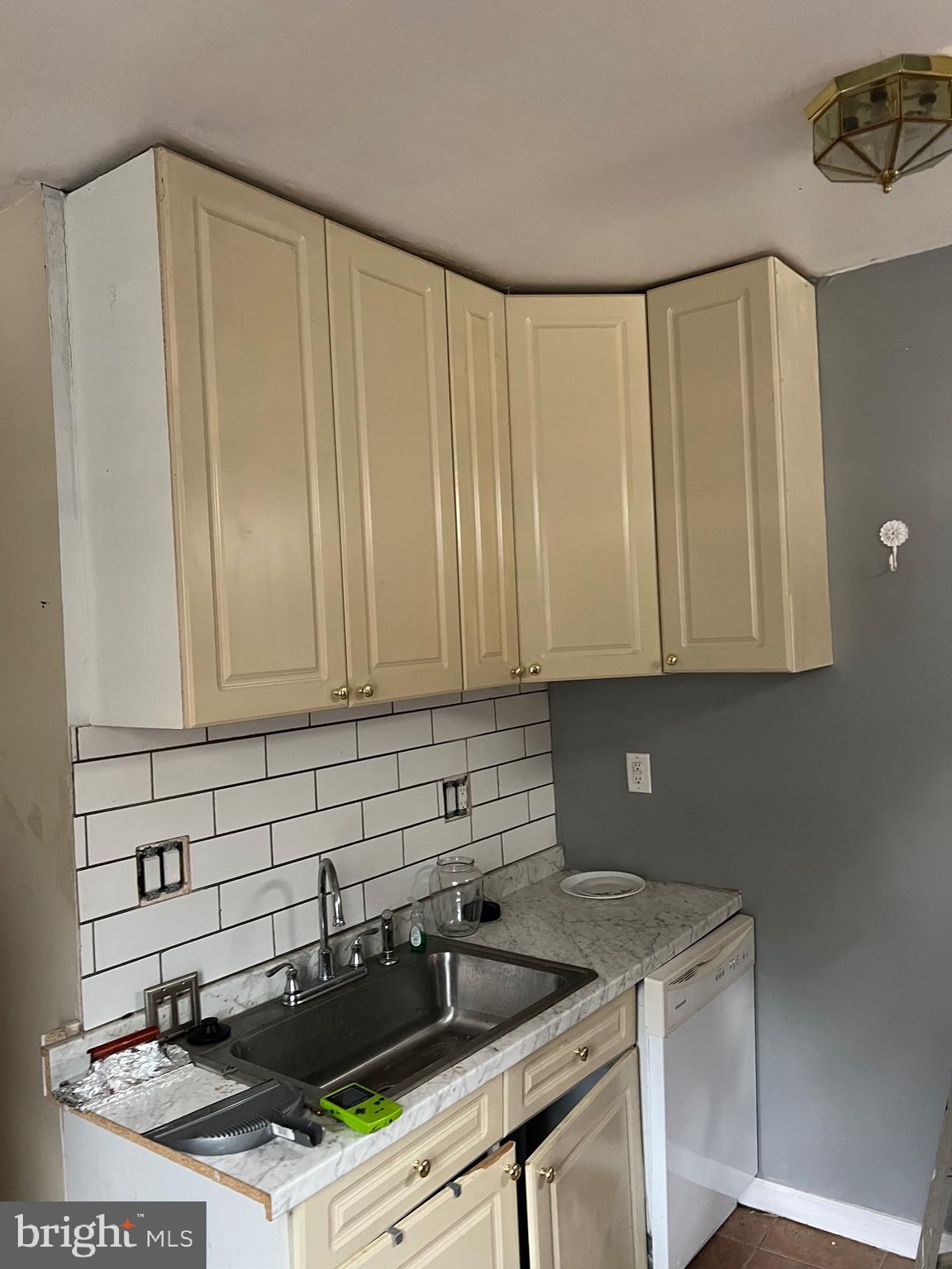 449 Baltimore Avenue Cumberland, MD 21502 - Photo 18 of 22 a kitchen with a sink a stove and cabinets