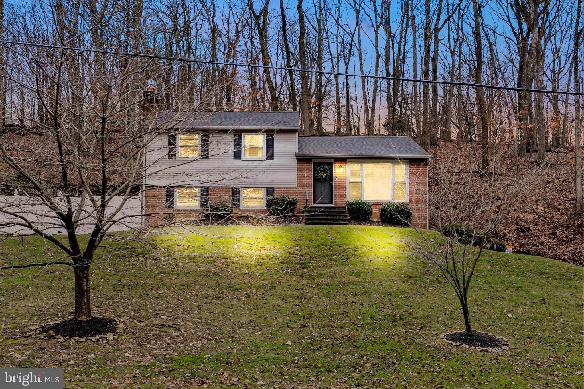 a front view of house with yard outdoor seating and barbeque oven