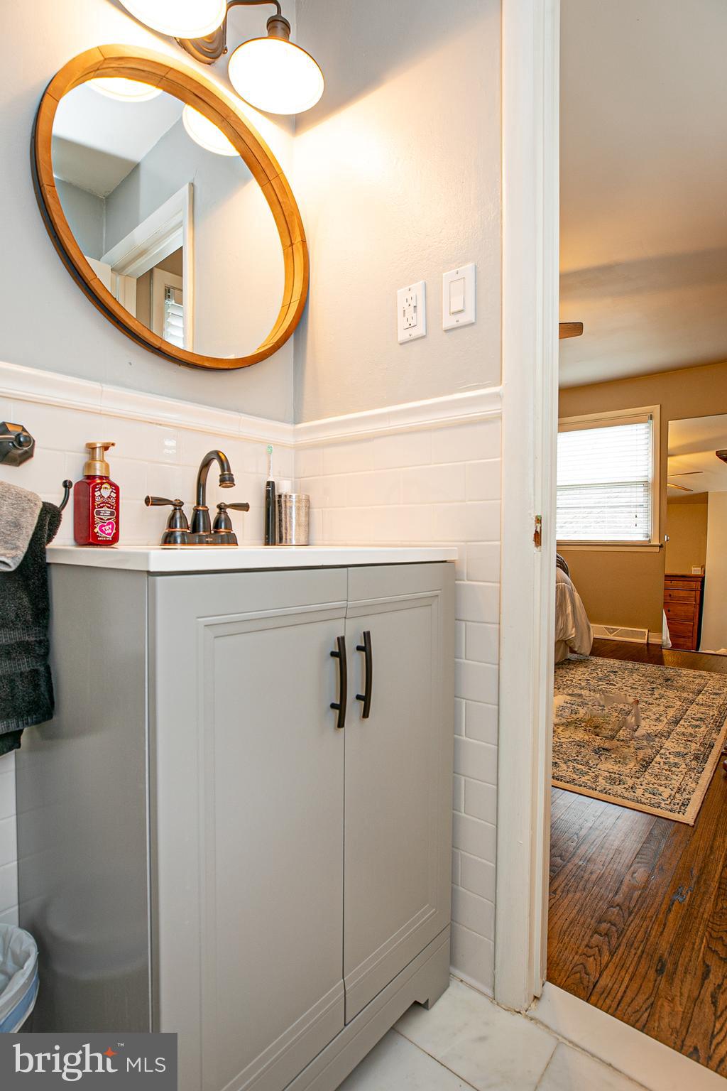 611 Brookwood Road Wayne, PA 19087 - Photo 19 of 41 a bathroom with a sink and a mirror