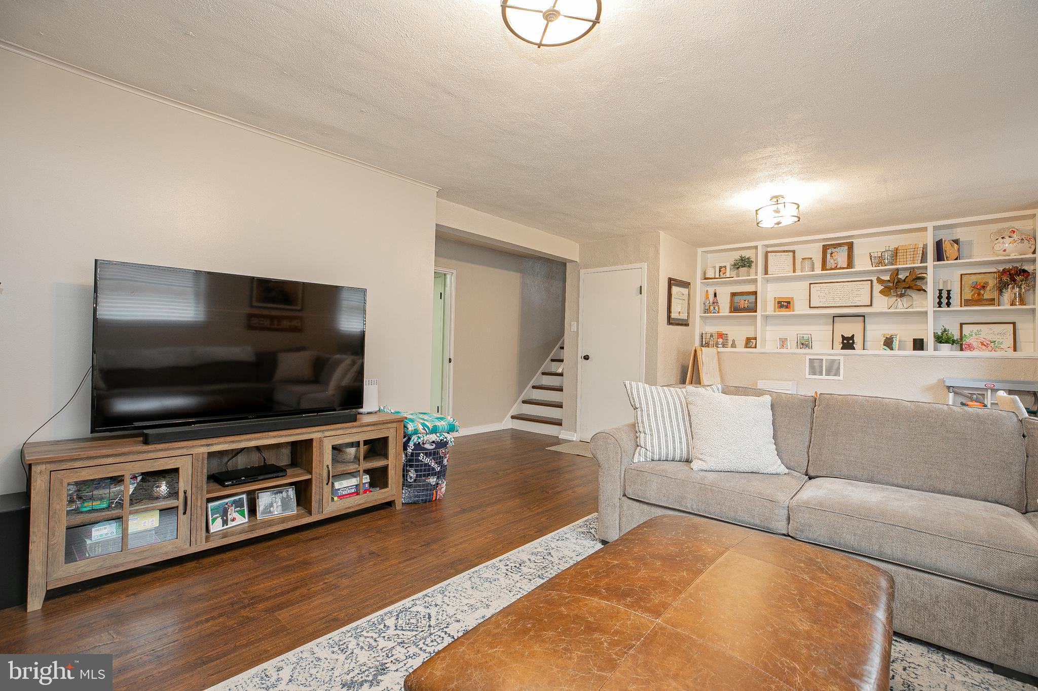 611 Brookwood Road Wayne, PA 19087 - Photo 27 of 41 a living room with furniture and a flat screen tv