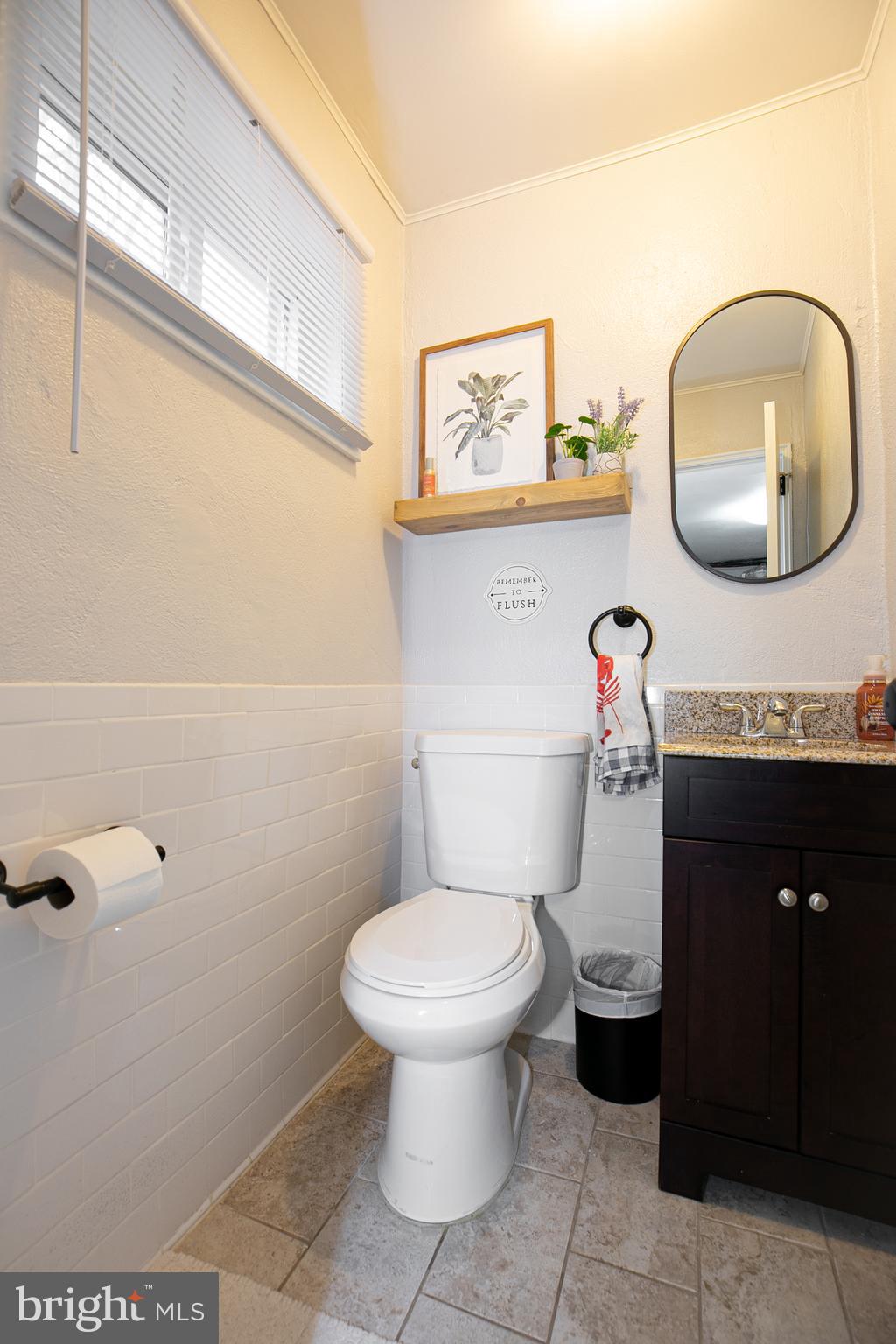 611 Brookwood Road Wayne, PA 19087 - Photo 32 of 41 a bathroom with a toilet and a mirror