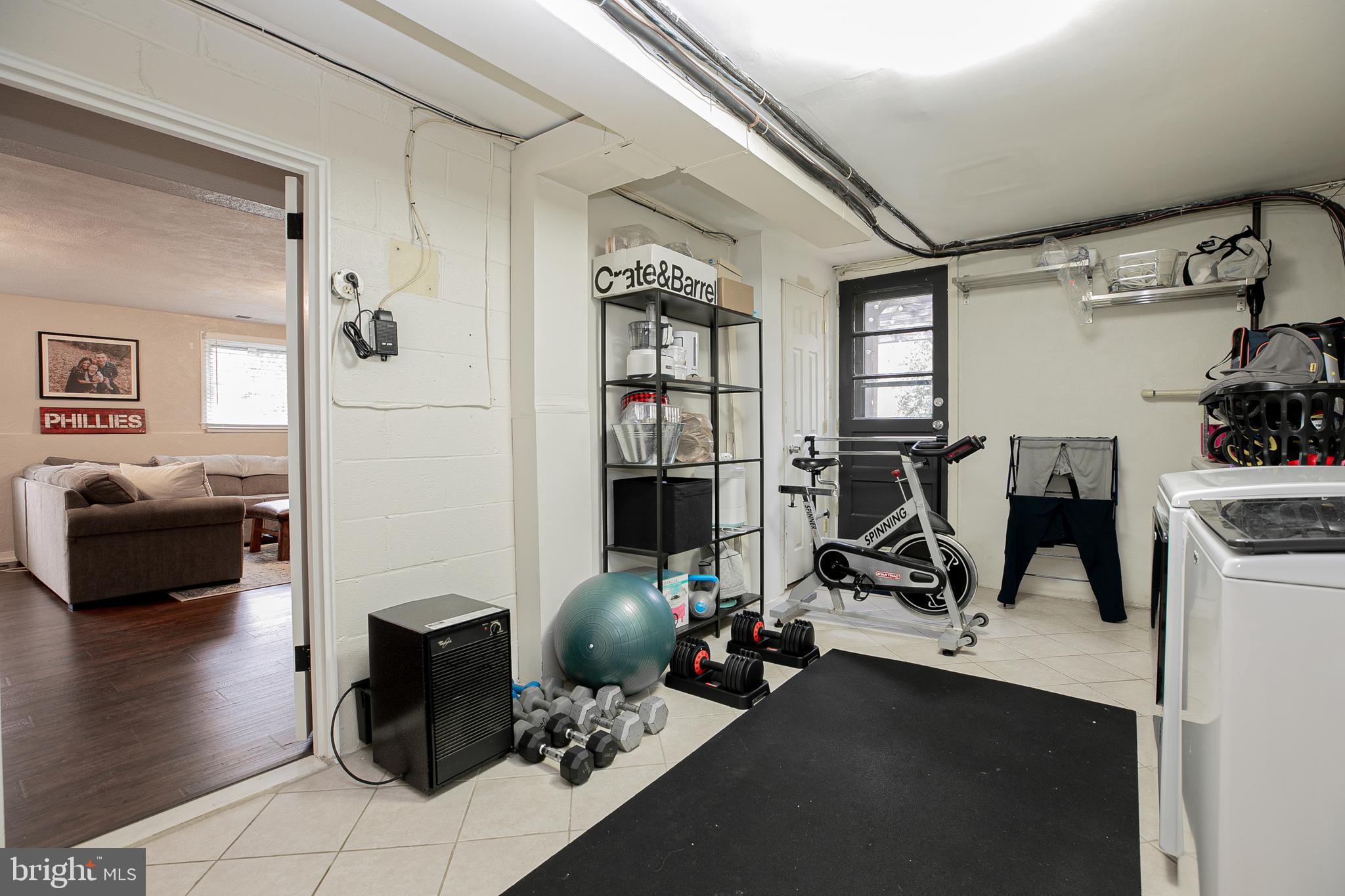 611 Brookwood Road Wayne, PA 19087 - Photo 33 of 41 a view of a livingroom with furniture and gym equipment