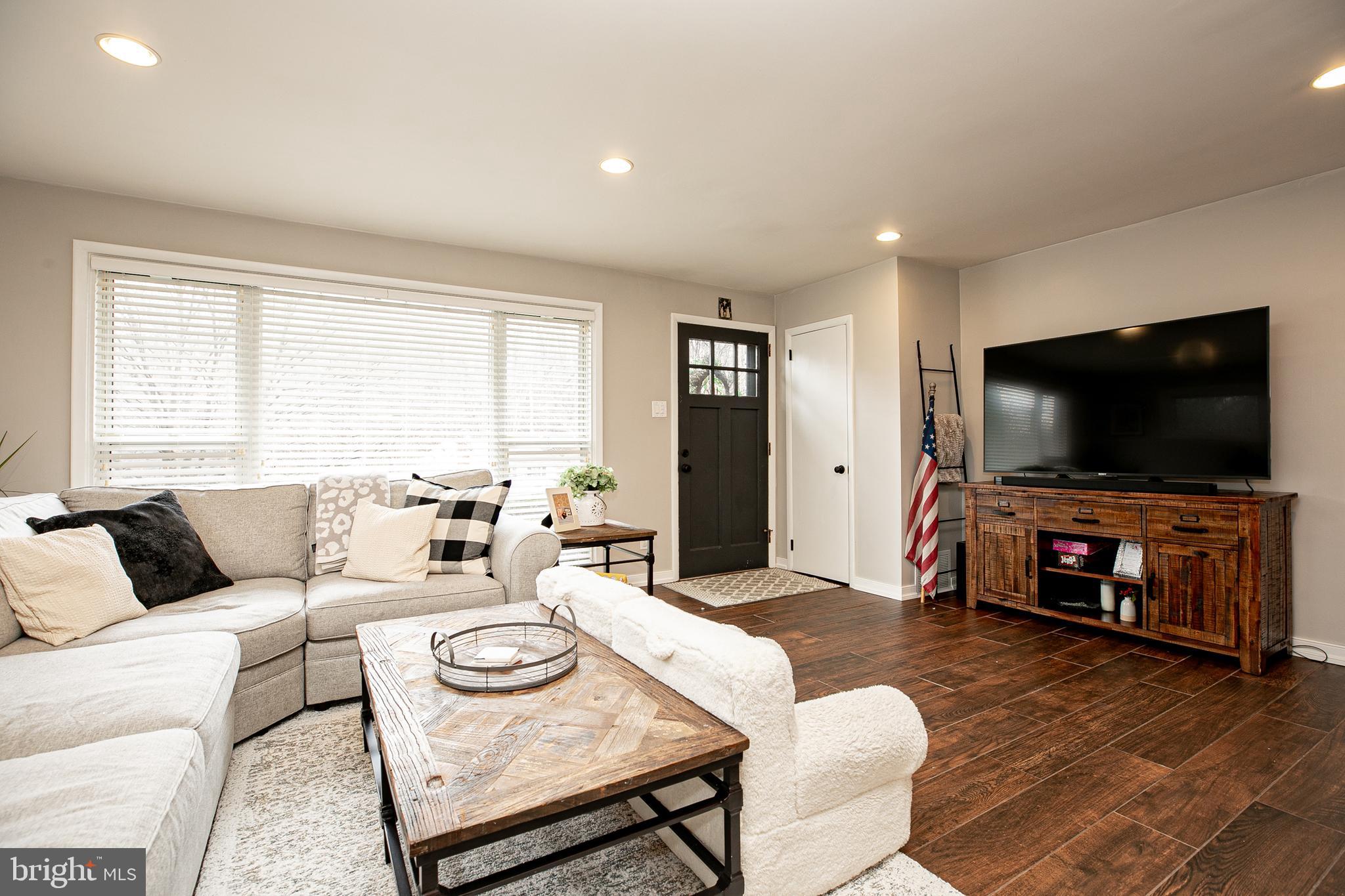 611 Brookwood Road Wayne, PA 19087 - Photo 6 of 41 a living room with furniture and a flat screen tv