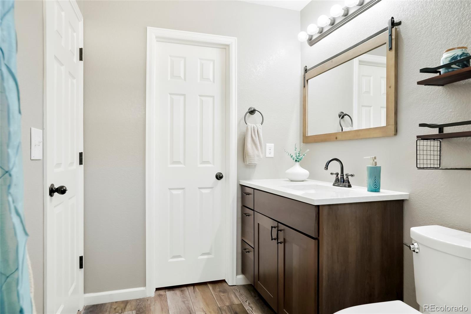 518 Draw Street Brighton, CO 80603 - Photo 15 of 35 a bathroom with a sink and a mirror