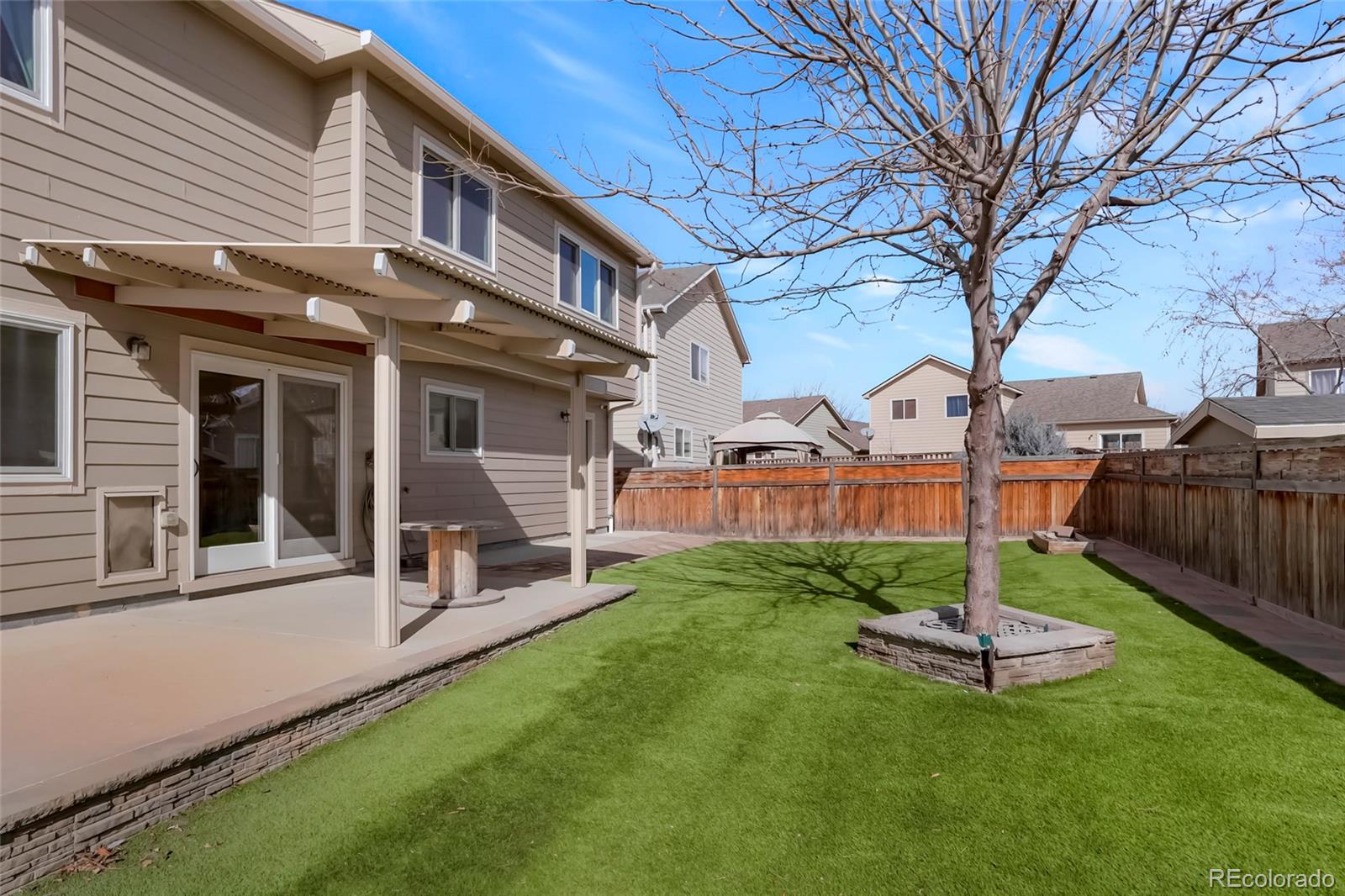 518 Draw Street Brighton, CO 80603 - Photo 26 of 35 a view of a patio with a table and chairs