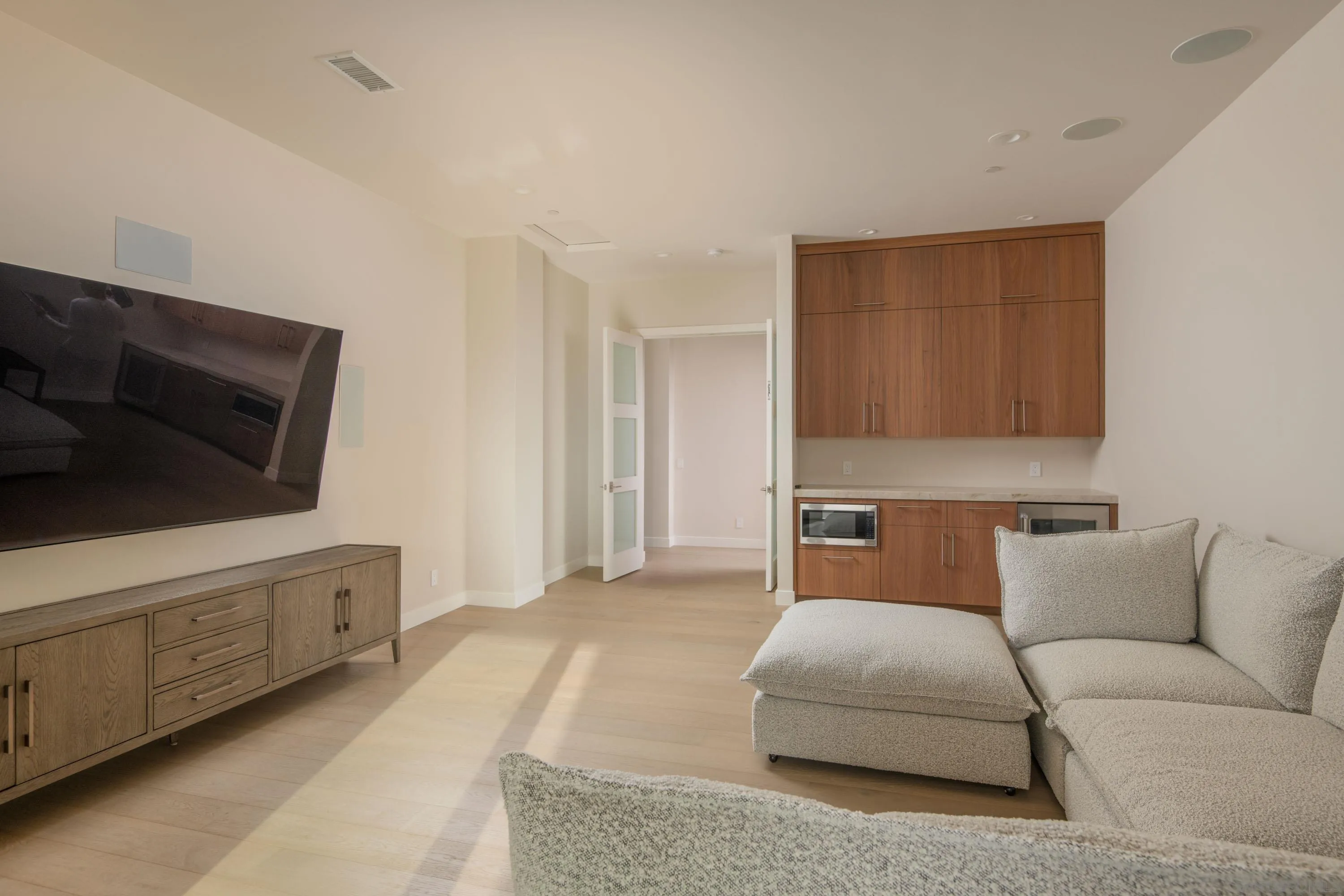 9521 La Jolla Farms Road La Jolla, CA 92037 - Photo 45 of 55 a bedroom with furniture and a flat screen tv