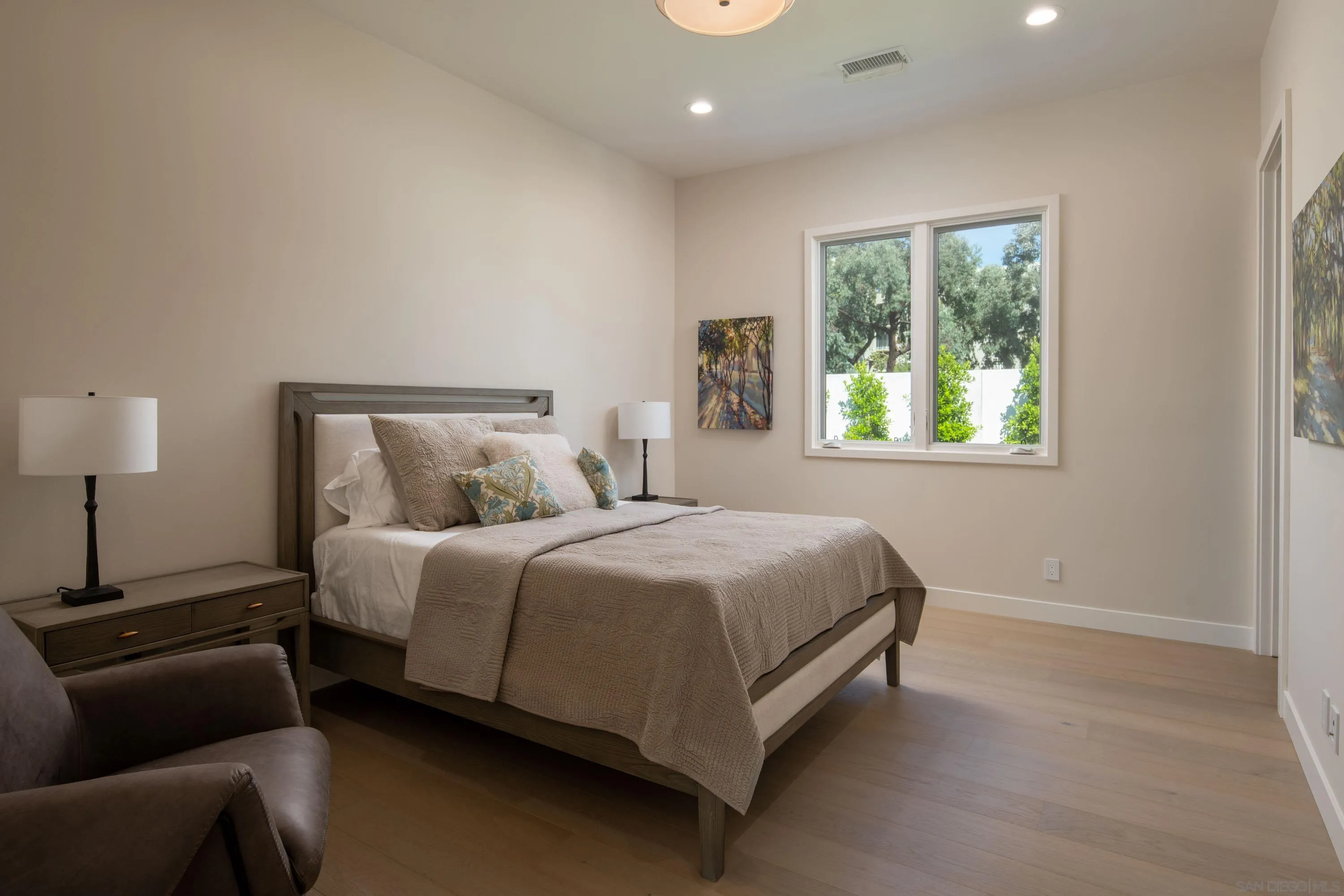 9521 La Jolla Farms Road La Jolla, CA 92037 - Photo 47 of 55 a bedroom with a bed and a couch
