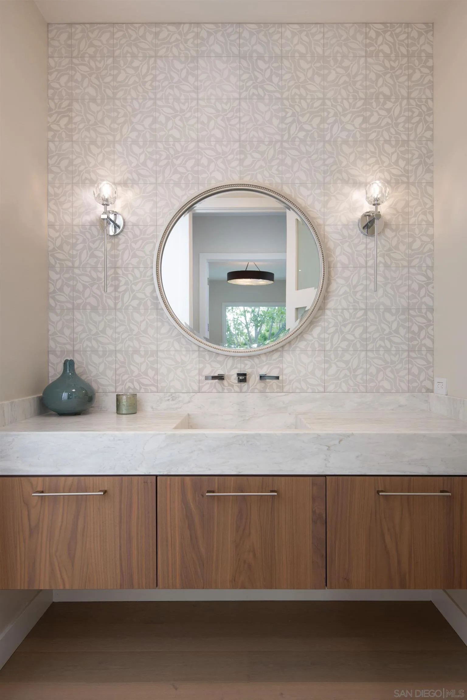 9521 La Jolla Farms Road La Jolla, CA 92037 - Photo 50 of 55 a bathroom with a sink a mirror and vanity