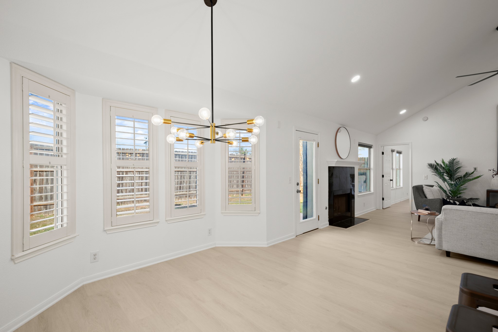 310 Bailey Loop Kyle, TX 78640 - Photo 12 of 30 Dining space with light wood-style floors, vaulted ceiling, and hanging lights