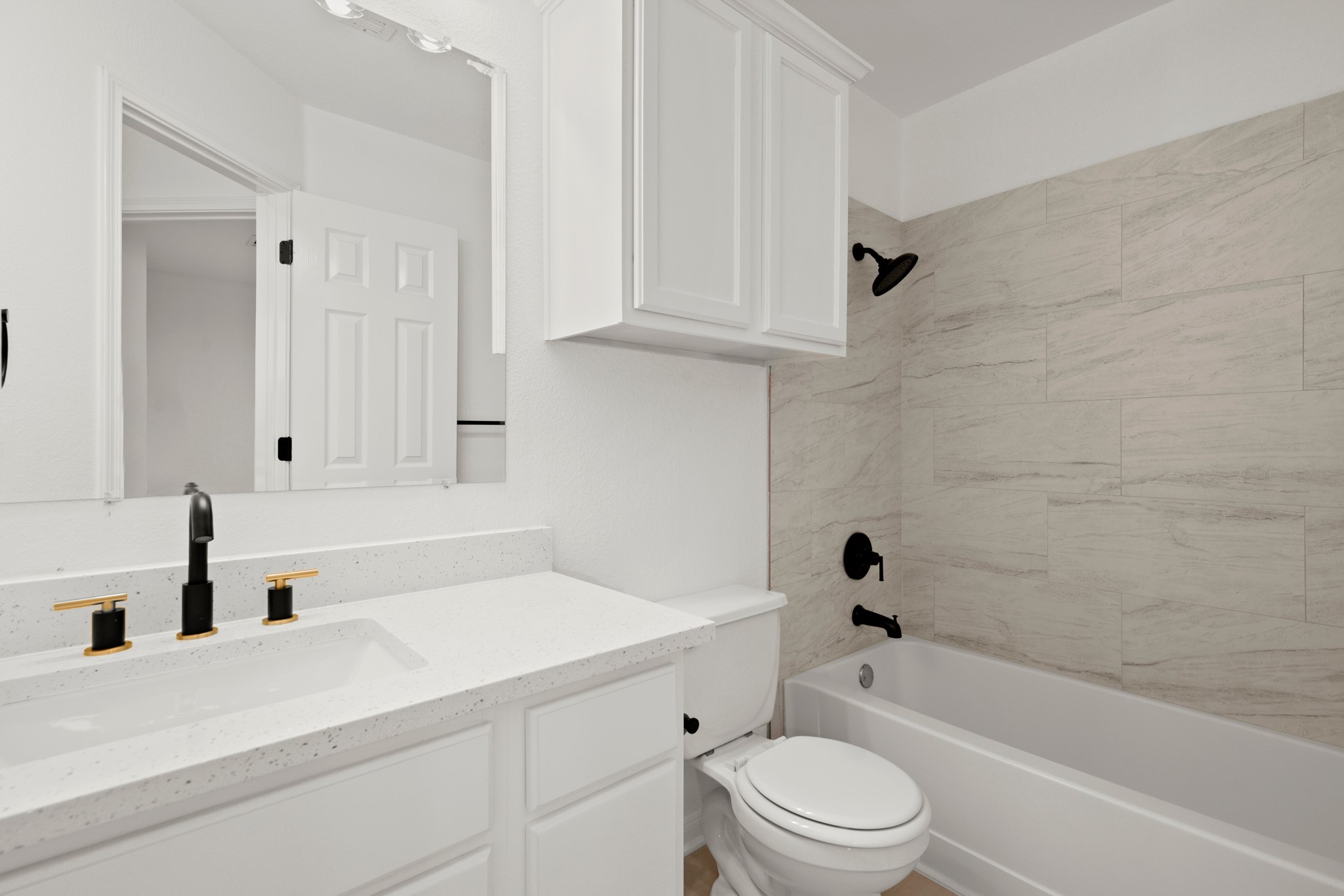 310 Bailey Loop Kyle, TX 78640 - Photo 25 of 30 Full bathroom with vanity and shower / bathtub combination