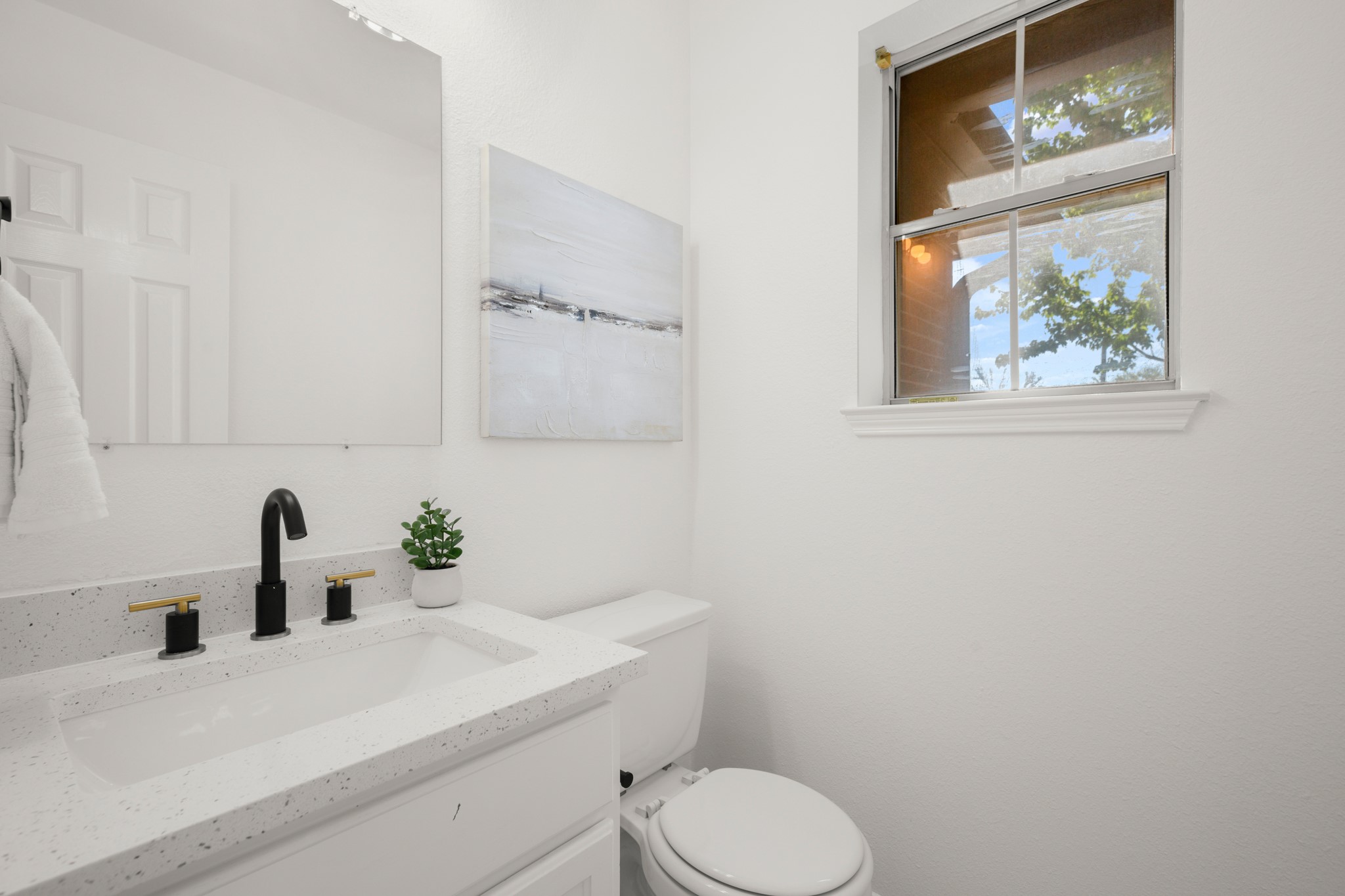 310 Bailey Loop Kyle, TX 78640 - Photo 8 of 30 Half bathroom with vanity and toilet