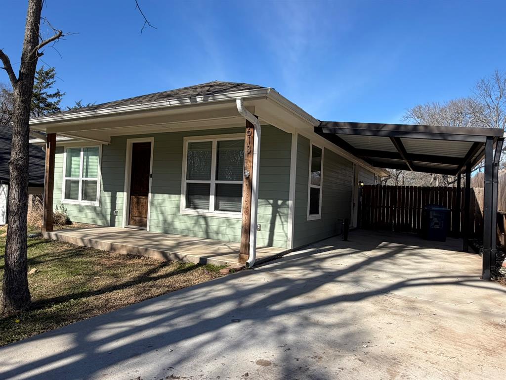 613 West Parnell Street Denison, TX 75020 - Photo 1 of 14 a view of a house with a patio