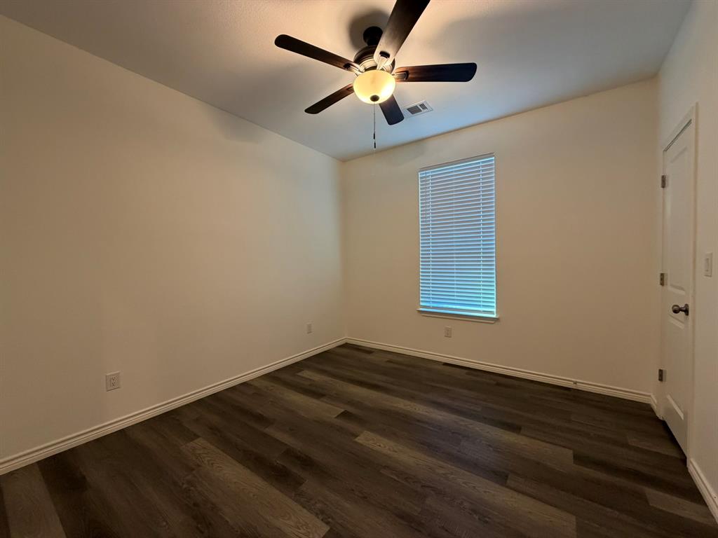 613 West Parnell Street Denison, TX 75020 - Photo 7 of 14 a view of an empty room with a window
