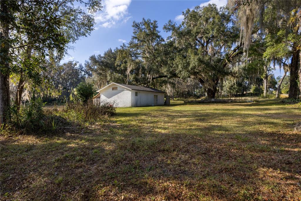560 Northwest 39th Road Gainesville, FL 32607 - Photo 9 of 13 a view of a field with an trees