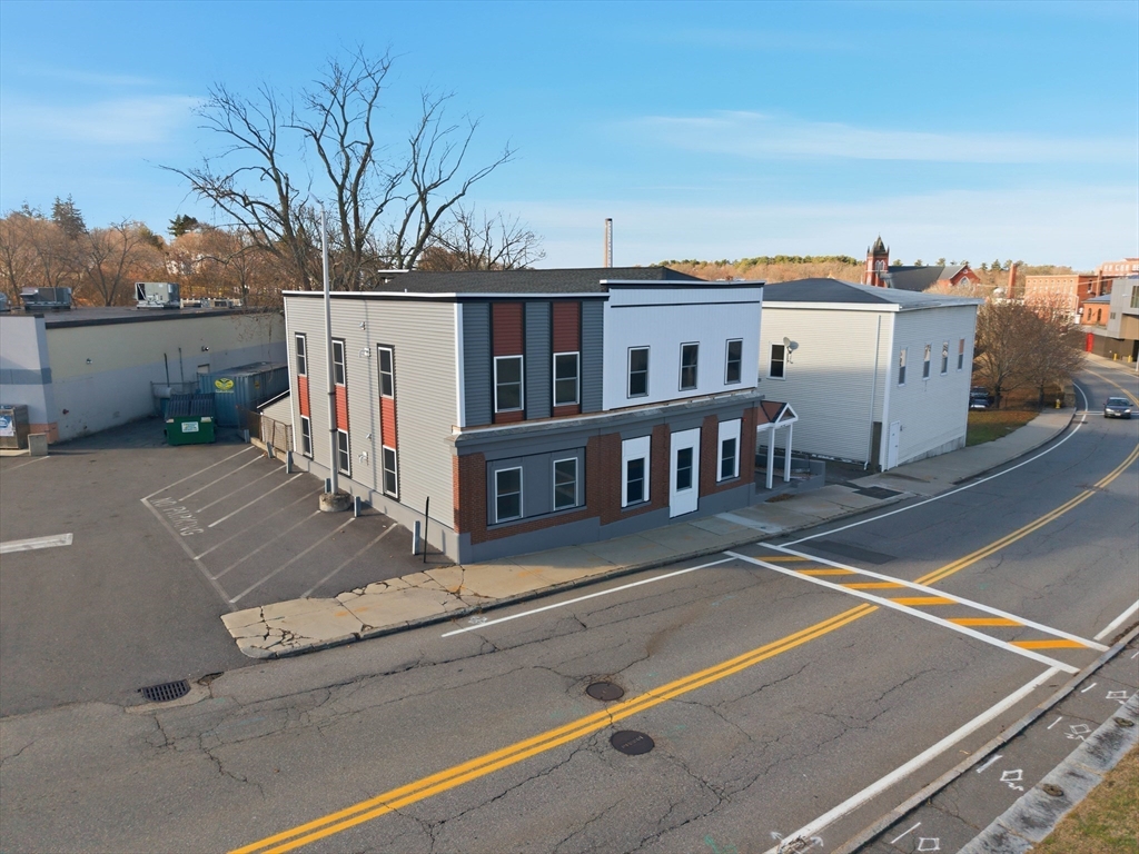 115-117 Mechanic Street, Unit 3 Clinton, MA 01510 - Photo 17 of 17 a view of a terrace with a bench