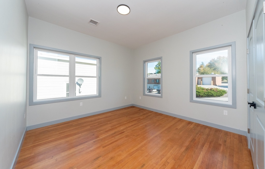 115-117 Mechanic Street, Unit 3 Clinton, MA 01510 - Photo 7 of 17 an empty room with windows