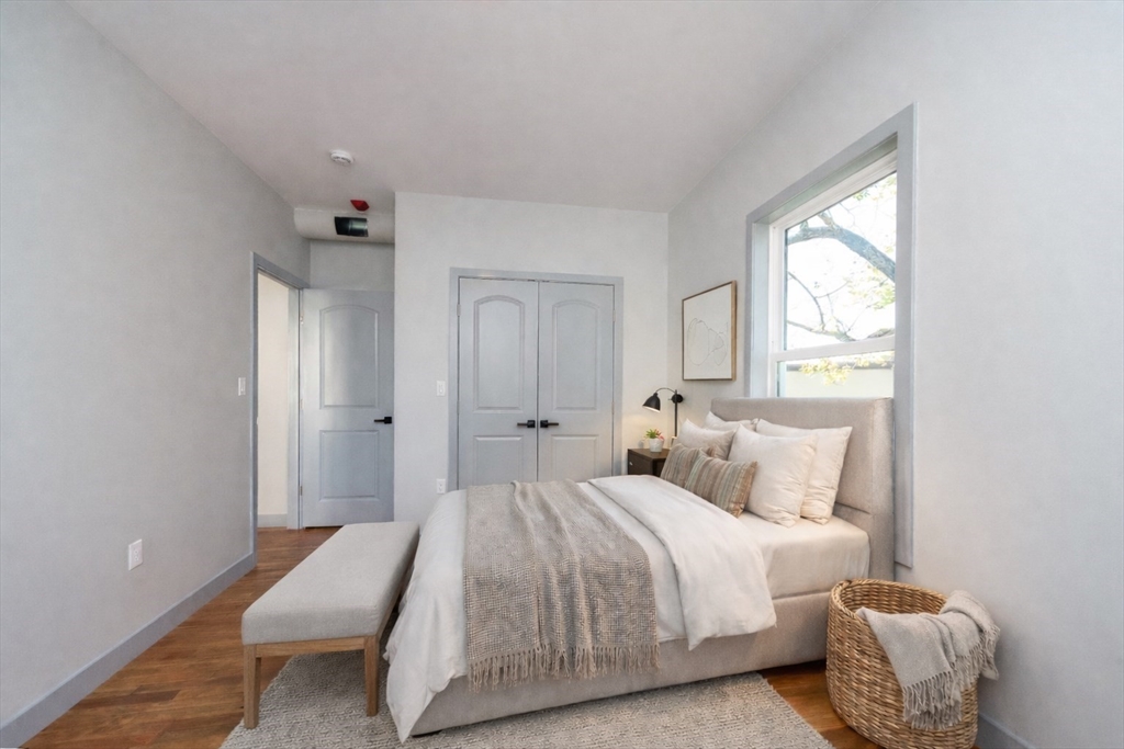 115-117 Mechanic Street, Unit 3 Clinton, MA 01510 - Photo 8 of 17 a bedroom with a bed and a window