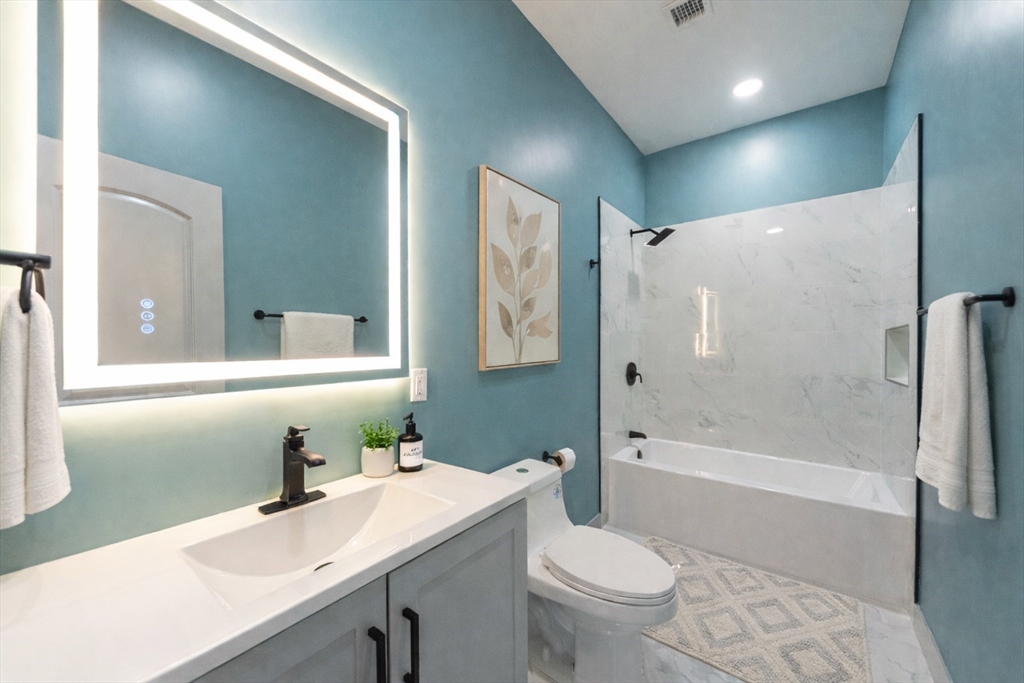 115-117 Mechanic Street, Unit 3 Clinton, MA 01510 - Photo 10 of 17 a bathroom with a sink a toilet and shower