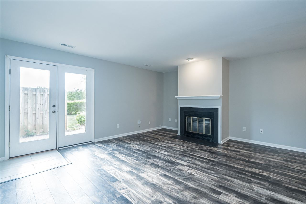 6905 Saxby Court Raleigh, NC 27613 - Photo 4 of 20 Living Room has a Wood-Burning Fireplace