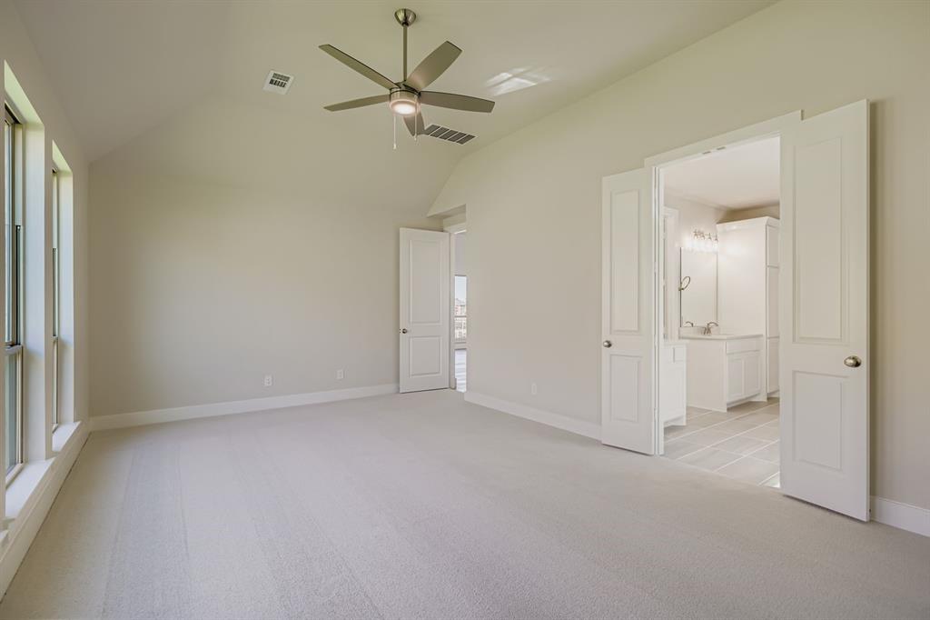 4203 Windy Point Court Oak Point, TX 75068 - Photo 13 of 29 an empty room with a ceiling fan and a window