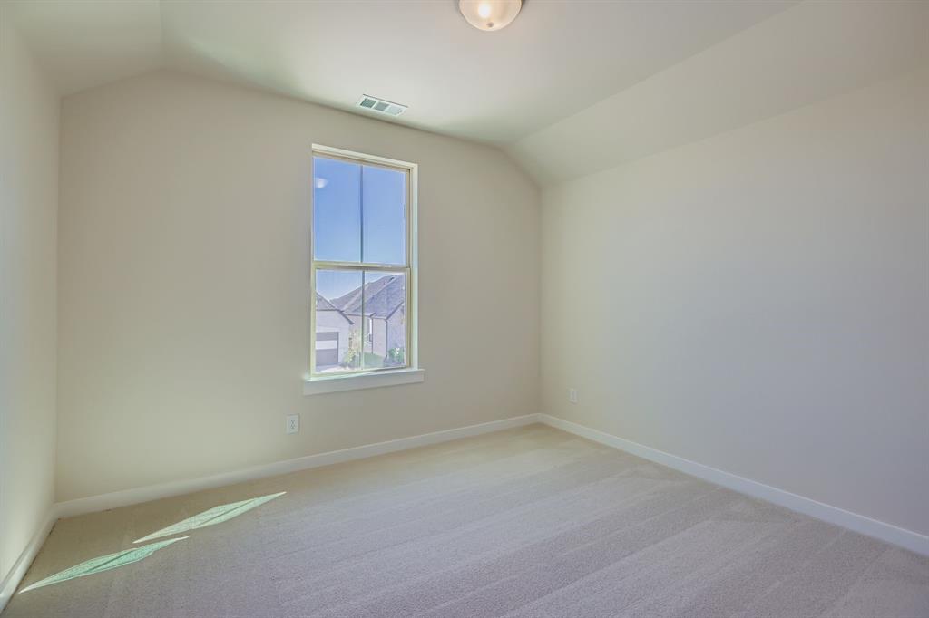 4203 Windy Point Court Oak Point, TX 75068 - Photo 19 of 29 an empty room with windows