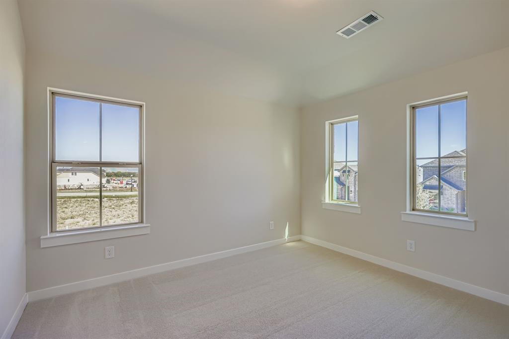 4203 Windy Point Court Oak Point, TX 75068 - Photo 20 of 29 a view of an empty room with windows