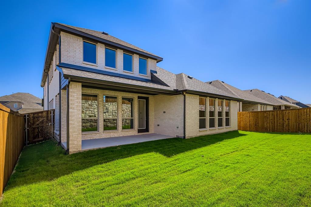 4203 Windy Point Court Oak Point, TX 75068 - Photo 28 of 29 a view of a house with yard and porch
