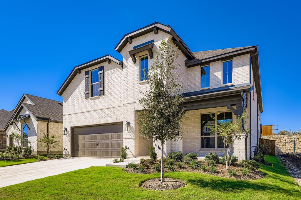 4203 Windy Point Court Oak Point, TX 75068 - Photo 3 of 29 a front view of a house with a yard