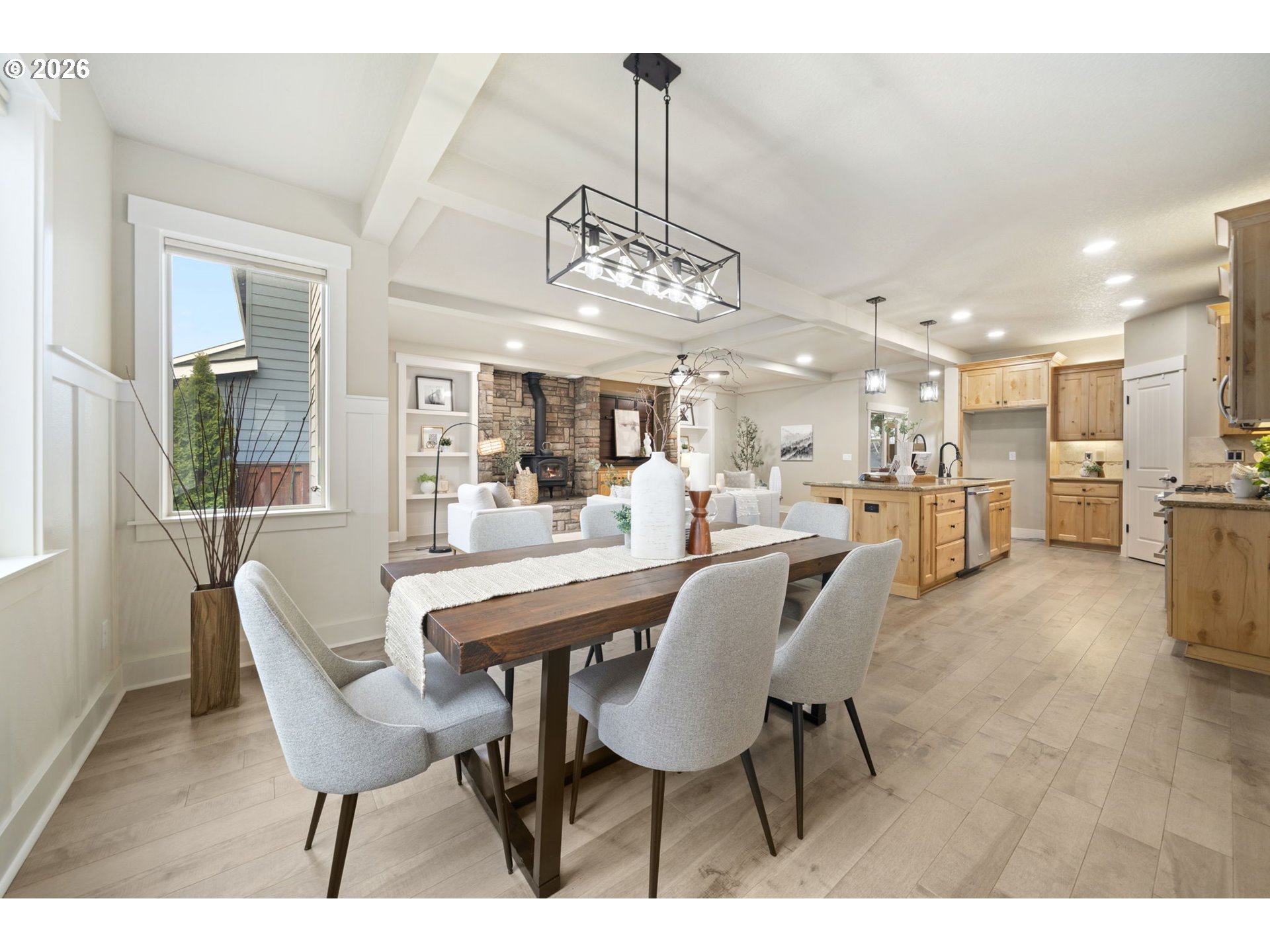 22421 Southwest Sequoia Terrace Sherwood, OR 97140 - Photo 14 of 48 a dining room with stainless steel appliances kitchen island a table and chairs
