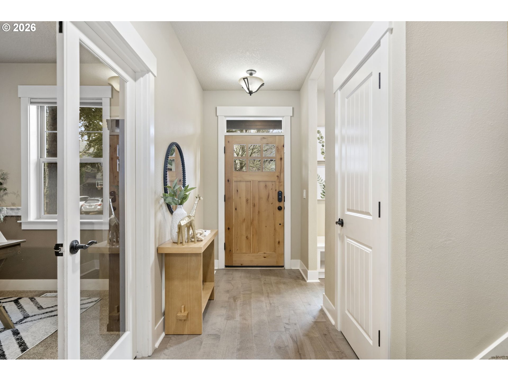 22421 Southwest Sequoia Terrace Sherwood, OR 97140 - Photo 19 of 48 a view of a hallway with wooden floor and dining room