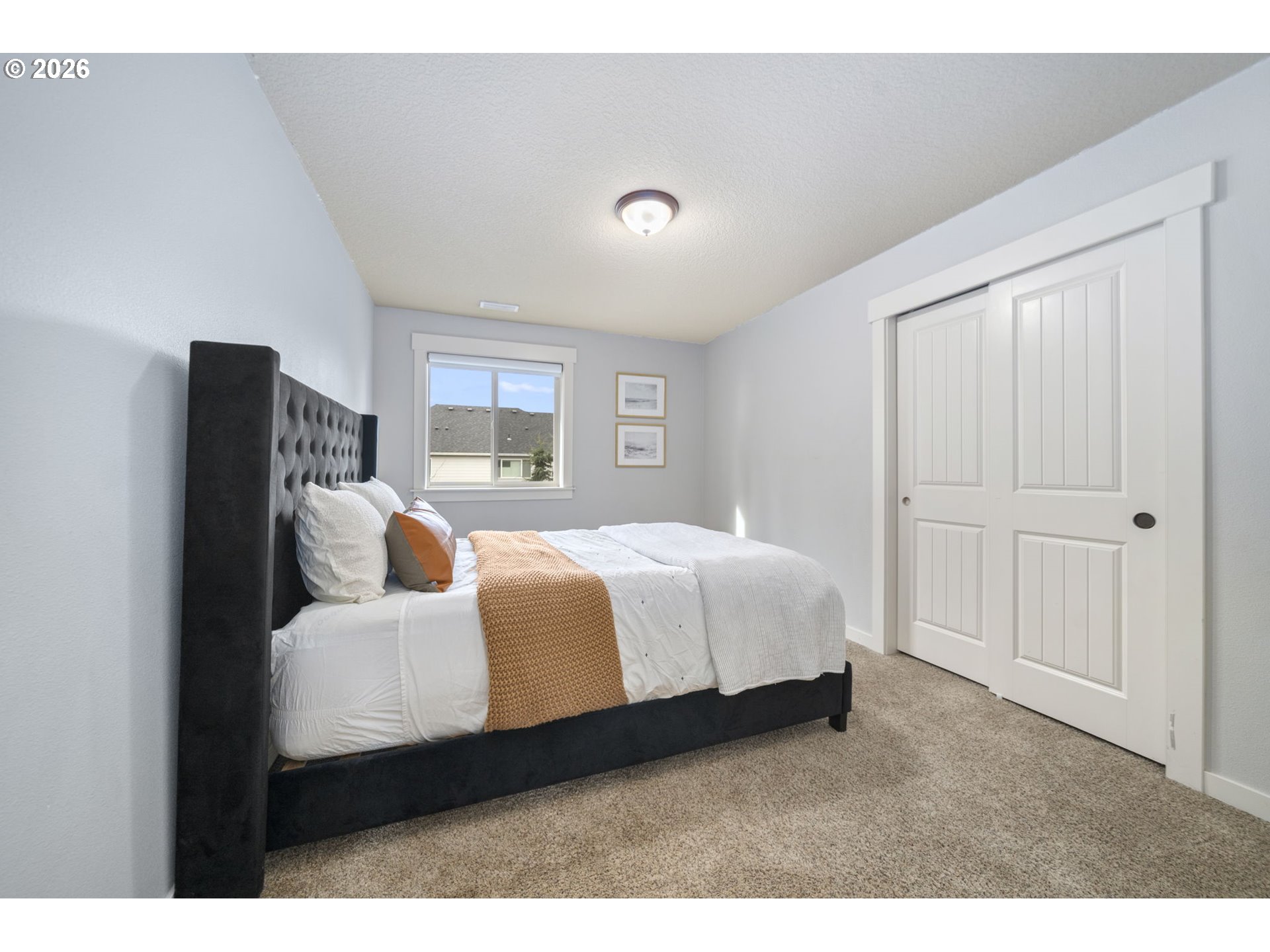 22421 Southwest Sequoia Terrace Sherwood, OR 97140 - Photo 30 of 48 a bedroom with a bed and wooden floor
