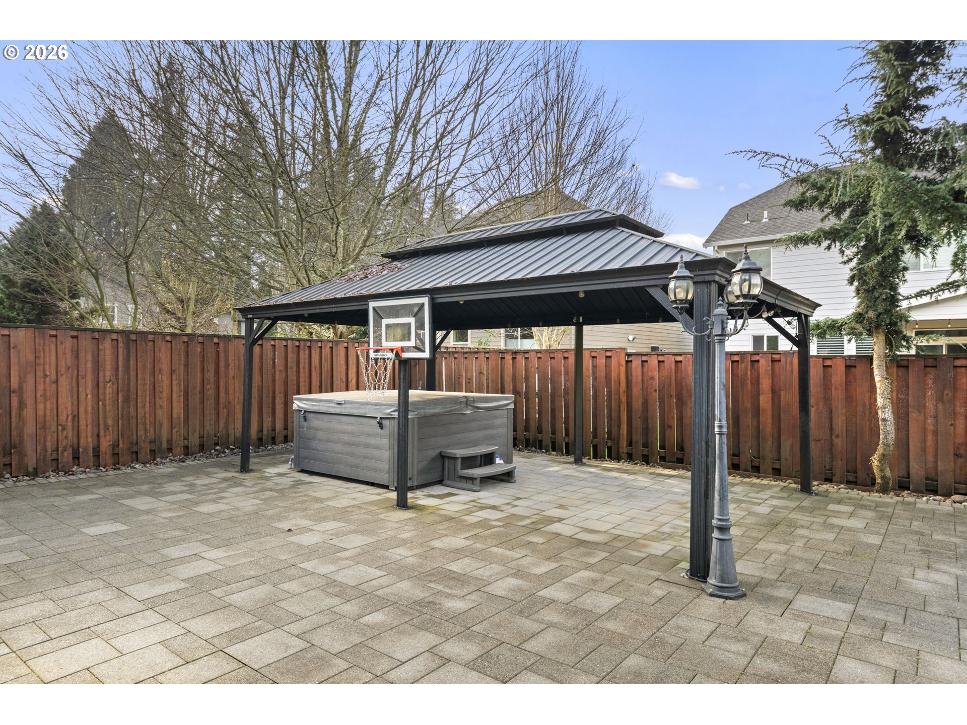 22421 Southwest Sequoia Terrace Sherwood, OR 97140 - Photo 41 of 48 a backyard of a house with barbeque oven and trees