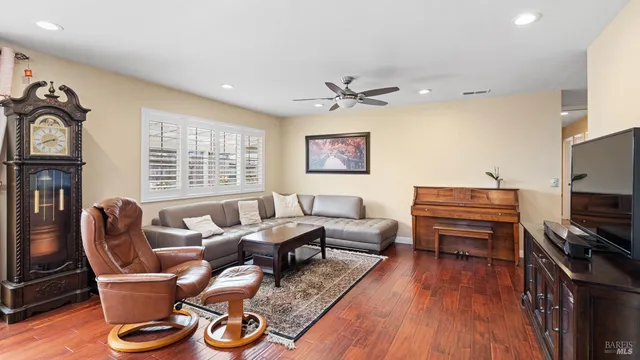 a bathroom with a granite countertop sink a mirror and a shower