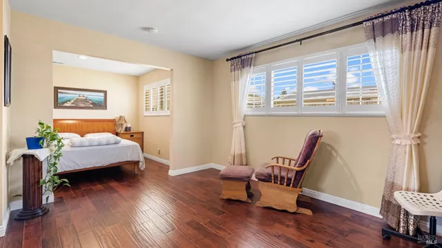 a bed room with a bed and a window