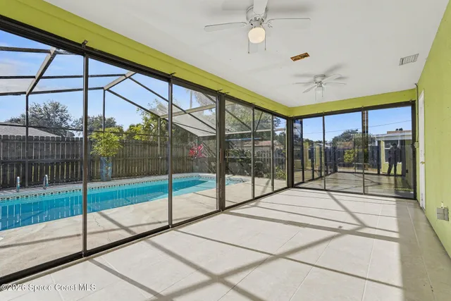 a view of a room with floor to ceiling windows