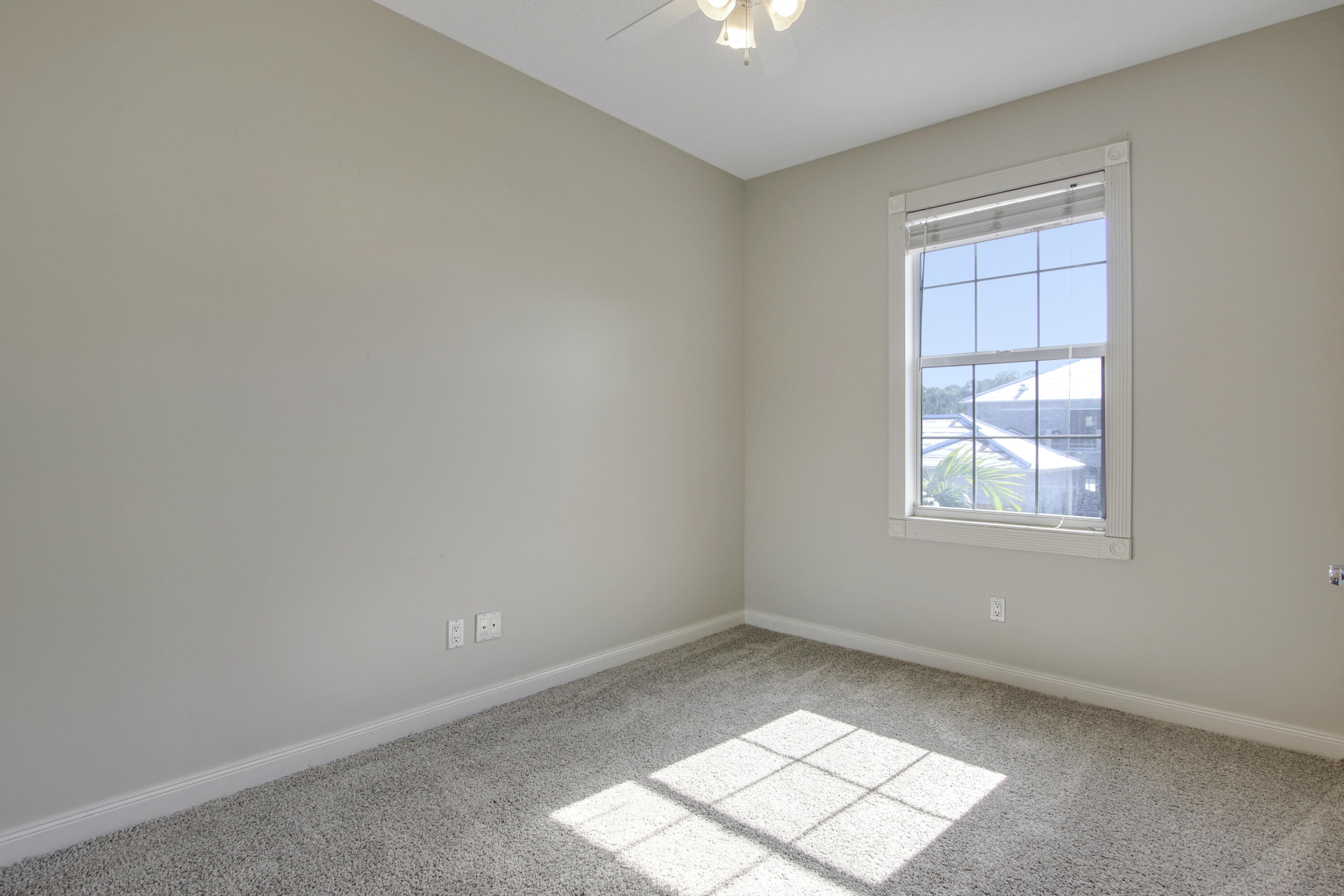 3057 East Community Drive Jupiter, FL 33458 - Photo 18 of 23 an empty room with a window