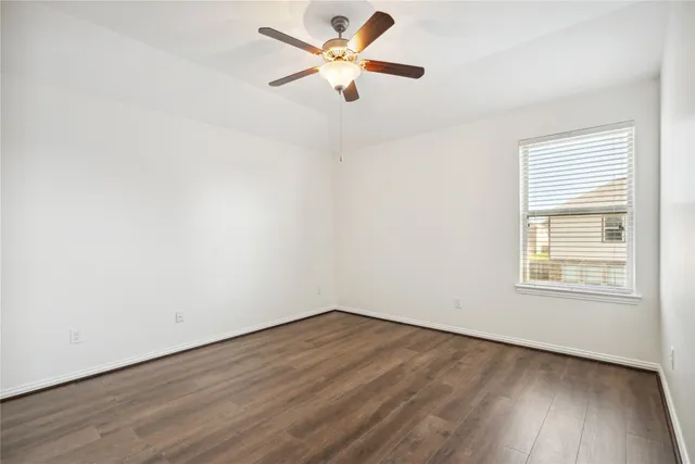 a bathroom with a bathtub shower sink mirror vanity and a toilet