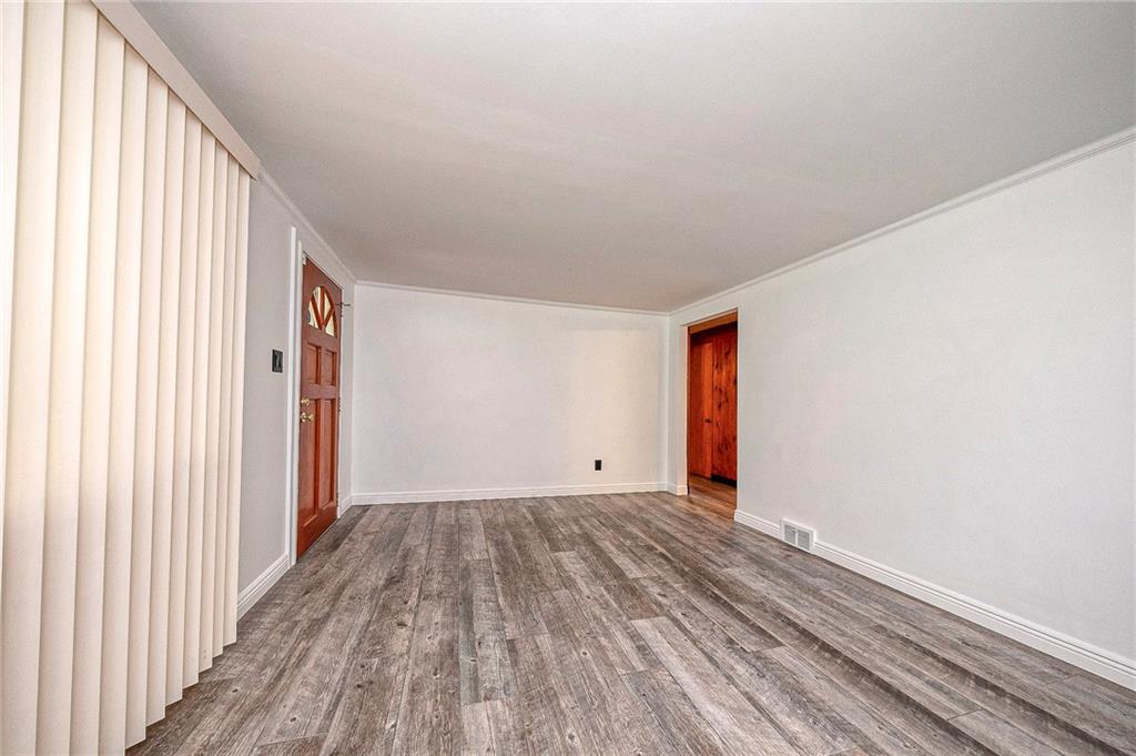 531 Laughlin Avenue Pittsburgh, PA 15210 - Photo 6 of 35 a view of a room with wooden floor and stairs
