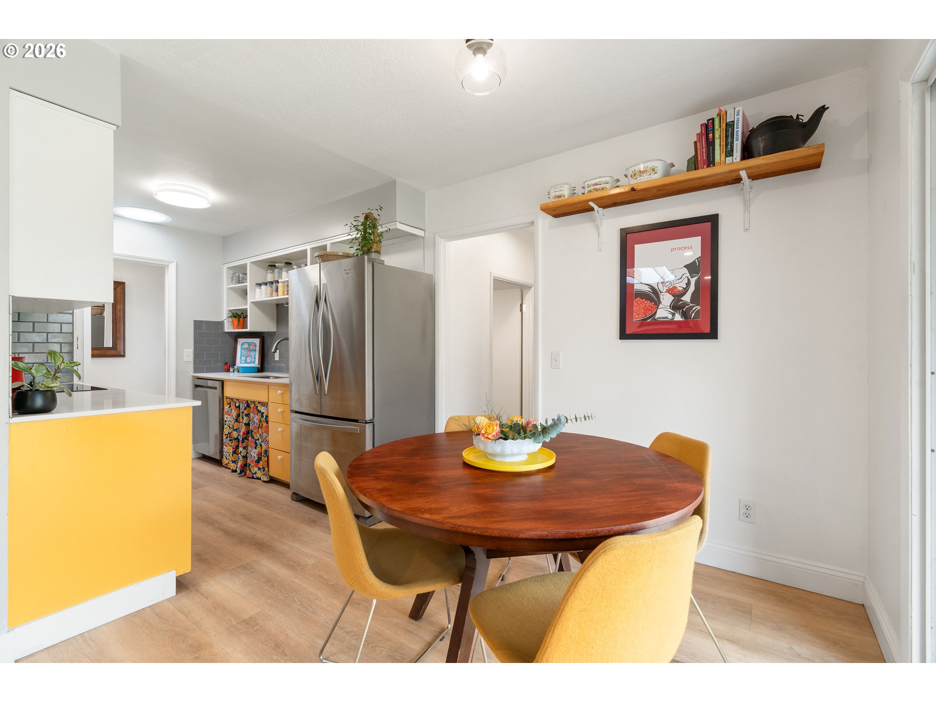 3835 North Alaska Street Portland, OR 97217 - Photo 11 of 43 a view of a dining room with furniture and wooden floor