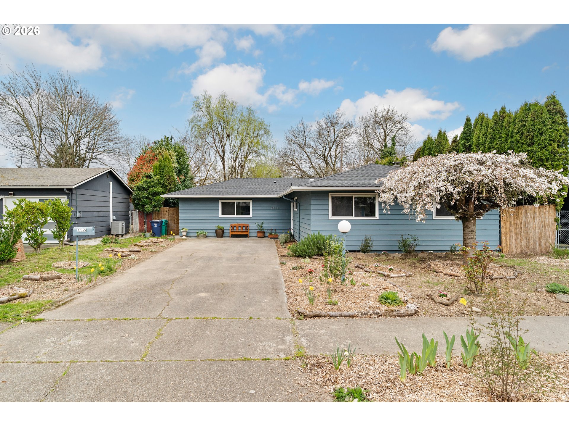 3835 North Alaska Street Portland, OR 97217 - Photo 2 of 43 a front view of a house with a yard and chandelier