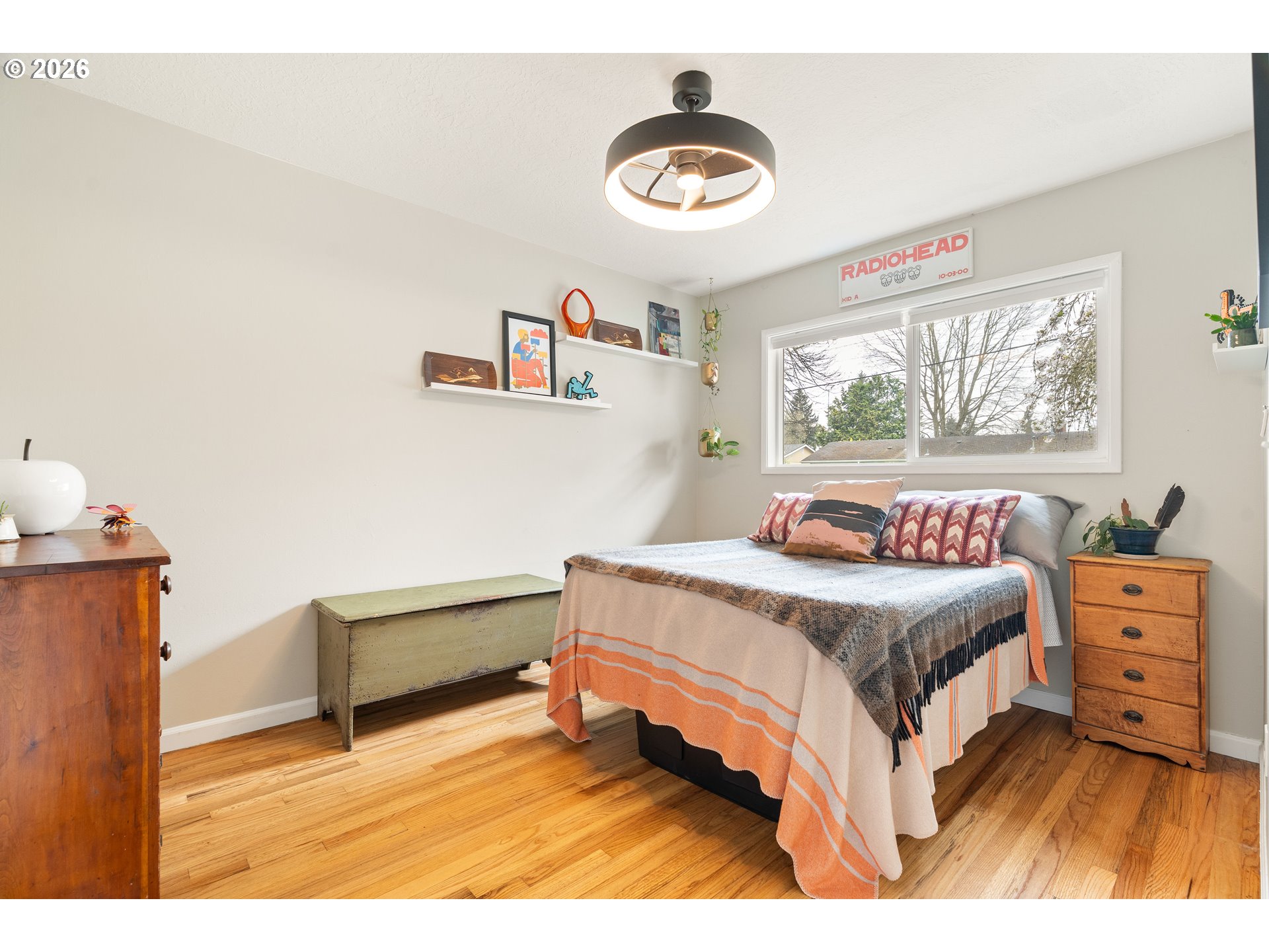 3835 North Alaska Street Portland, OR 97217 - Photo 22 of 43 a bedroom with a bed and a chandelier
