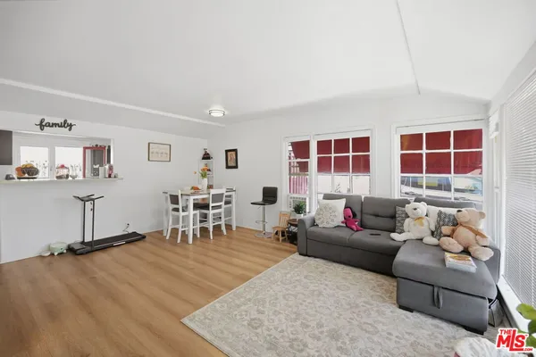 a living room with furniture and window